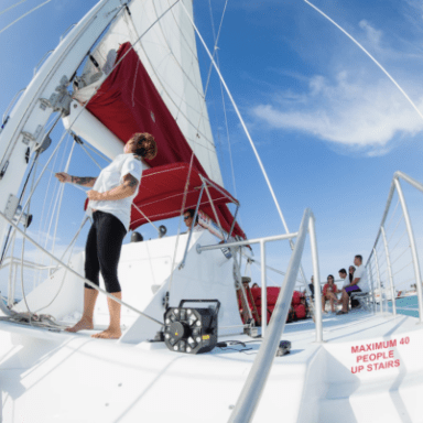woman adjusting boat sails