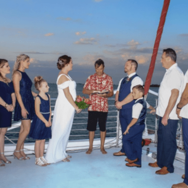 a group of people standing in front of a crowd posing for the camera