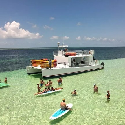 a group of people in a boat on a body of water