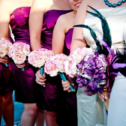 Bridal party holding bouquets of flowers