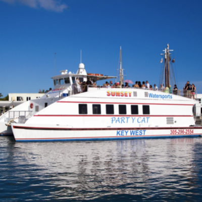 a boat docked next to a large body of water