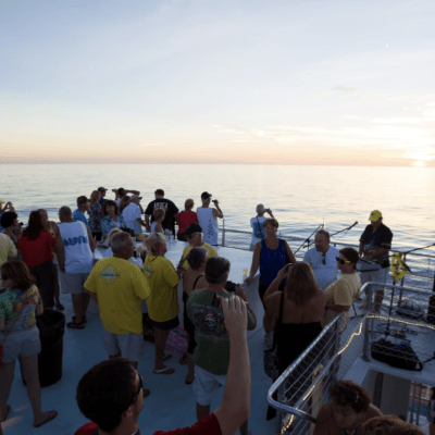 a group of people listening to live music on a boat