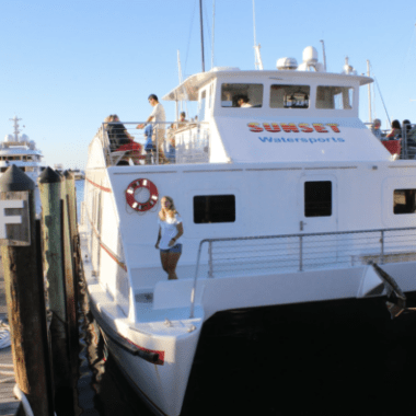 a boat docked next to a body of water