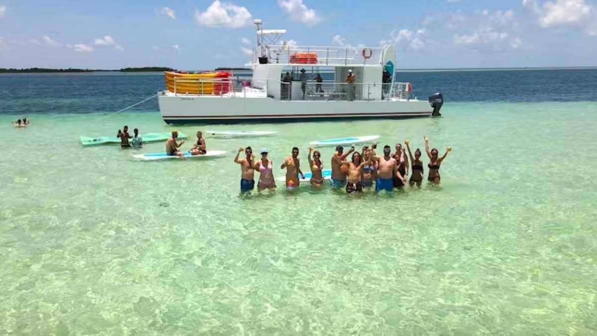Key west sandbar kayaking tour boat a group of people in a boat on a body of water