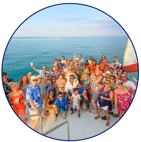 a group of people in front of a body of water